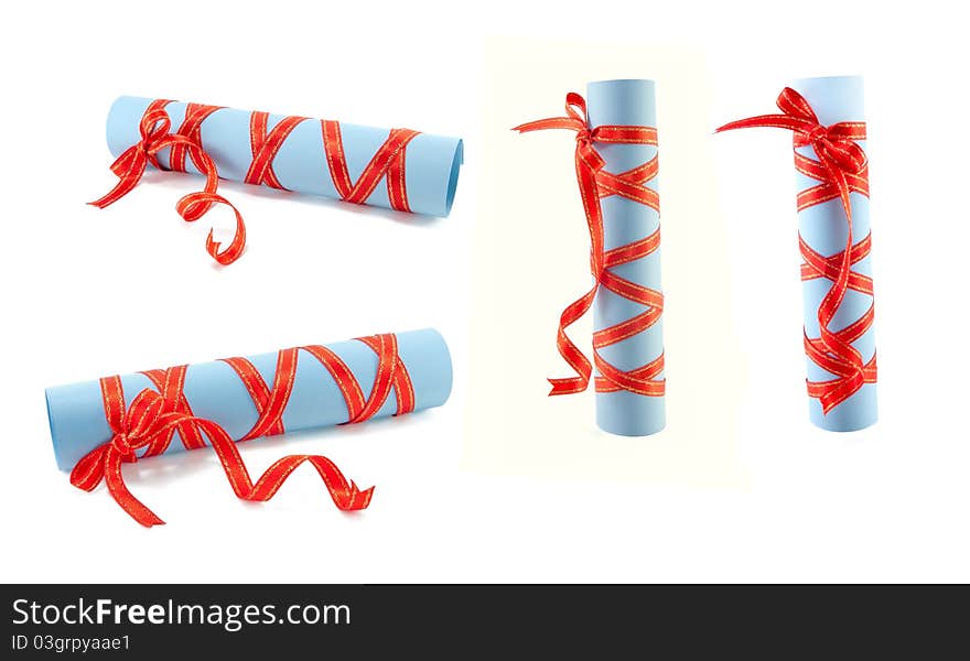 Rolls of a paper are isolated by the fastened red tape on a white background. Rolls of a paper are isolated by the fastened red tape on a white background