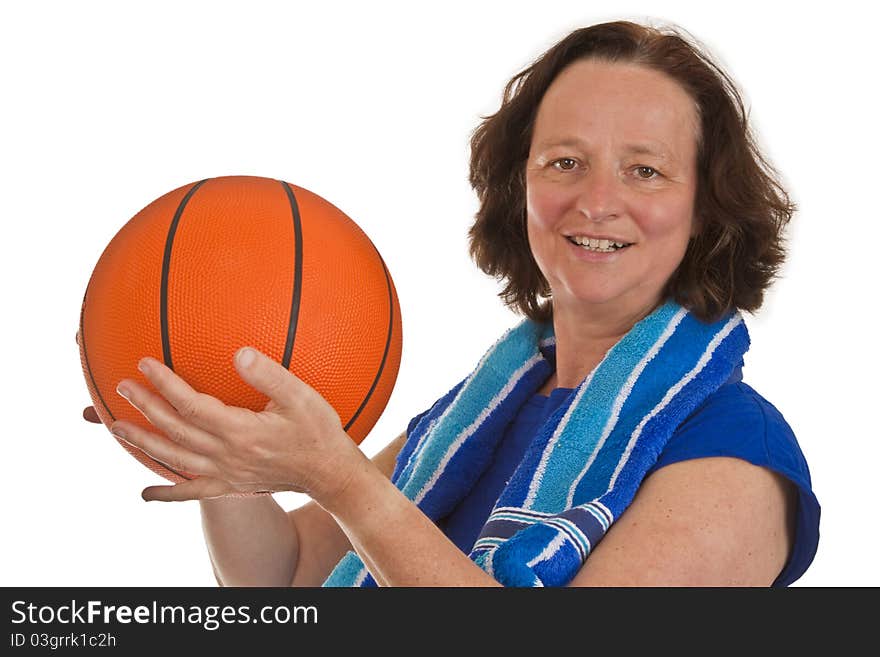 Middle aged woman with basketball on white background