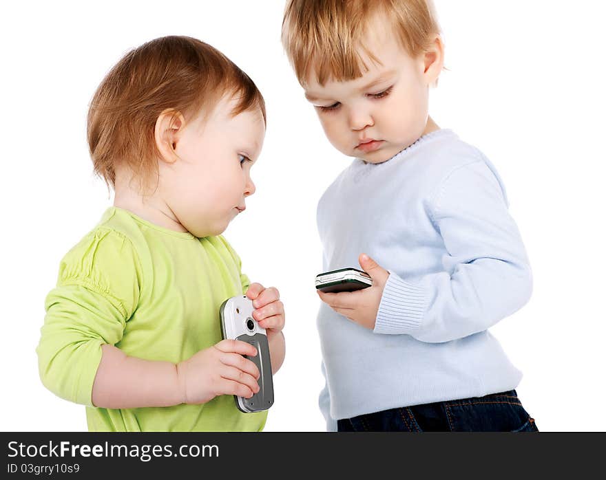 Surprised little girl and boy with the phone isolated