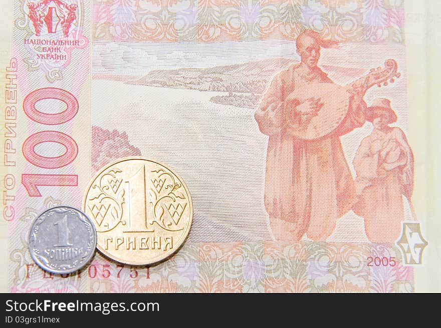 One Kopek And Hrivna Coins On One Hundred Bill