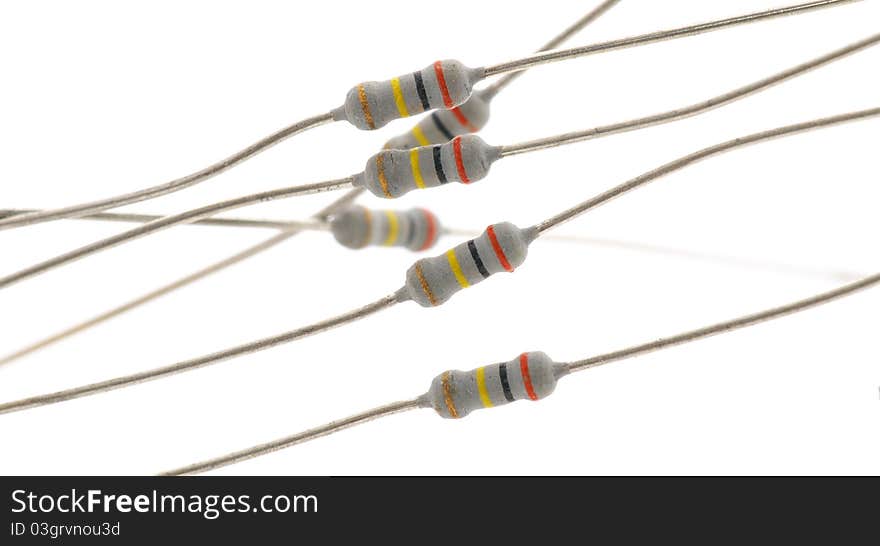 Some resistors on a light background. Isolated on white. Some resistors on a light background. Isolated on white.