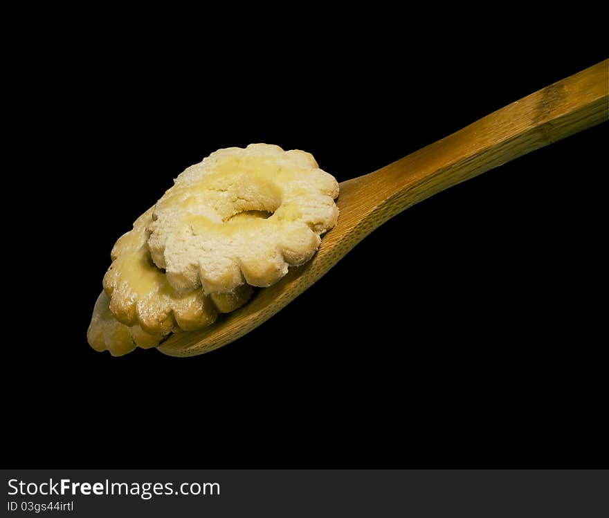 Traditional italian biscuit and wooden spoon isolated on white background