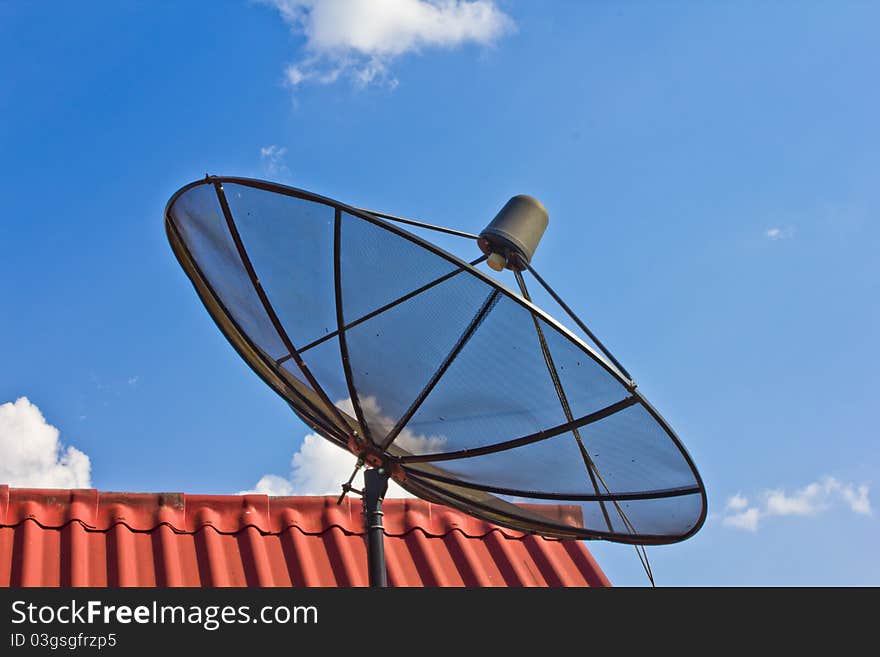 Satellite dish with clear blue sky