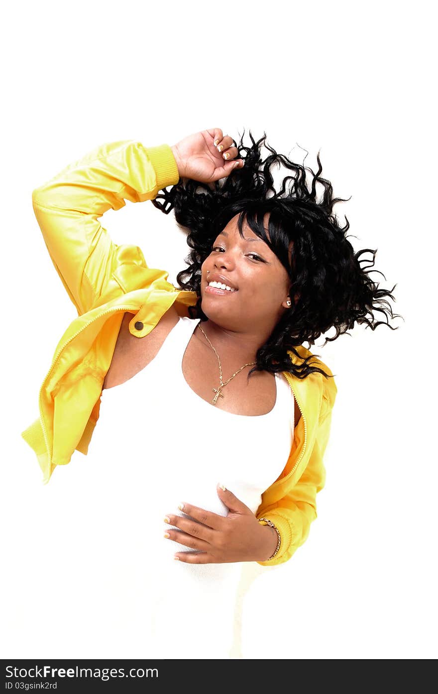 A beautiful young African American woman lying in a yellow jacket and white t-shirt on the floor, her black hair spread out, over white Background. A beautiful young African American woman lying in a yellow jacket and white t-shirt on the floor, her black hair spread out, over white Background.