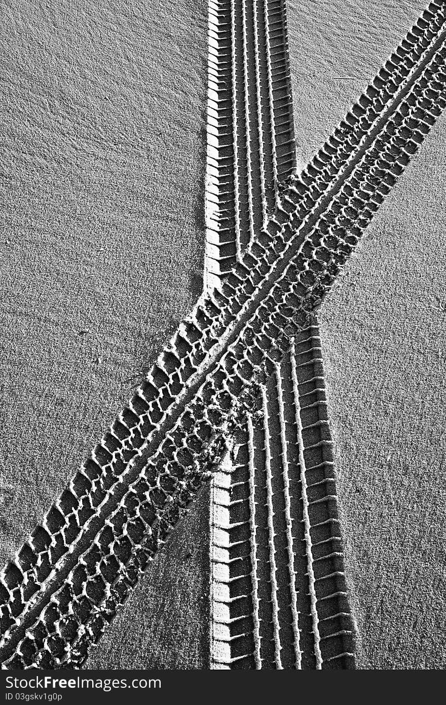 Two paths crossing in the sand. Two paths crossing in the sand.