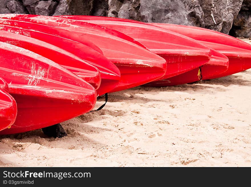 The red kayaks on the beach