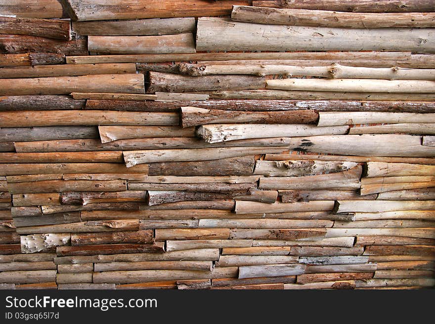 Wall made of logs of various sizes. Wall made of logs of various sizes.