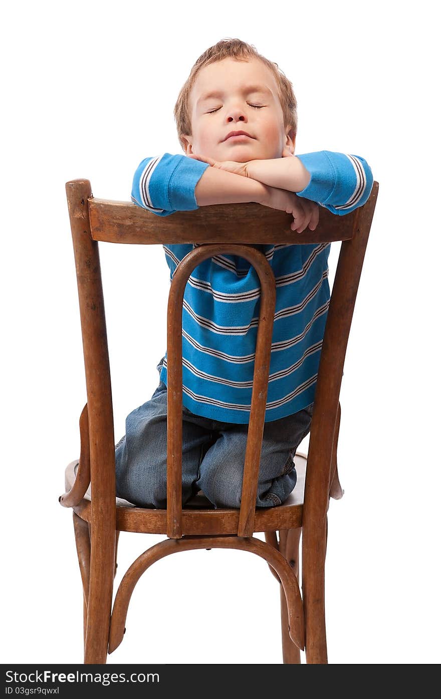 Little boy sits in chair with his eyes closed, isolation. Little boy sits in chair with his eyes closed, isolation