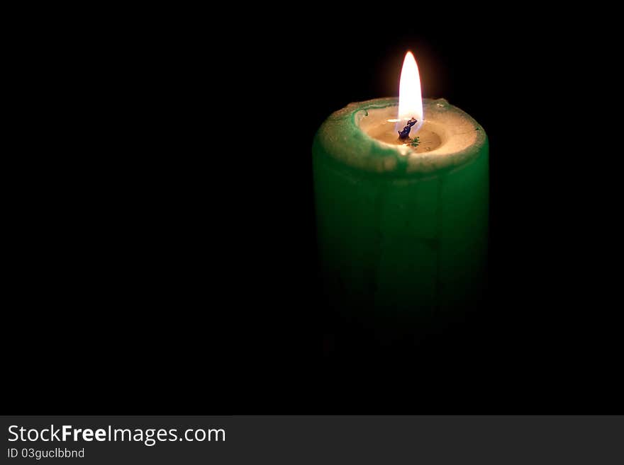 A candle shining in the darkness.