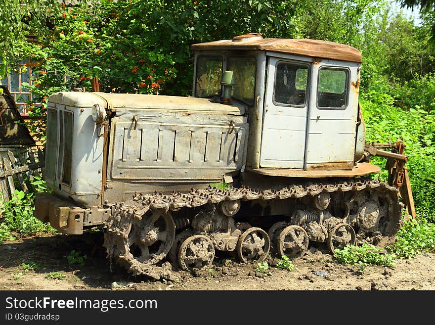 Very old Soviet Built Tractor that was left sitting out on a street in a small Ukrainian town. Very old Soviet Built Tractor that was left sitting out on a street in a small Ukrainian town