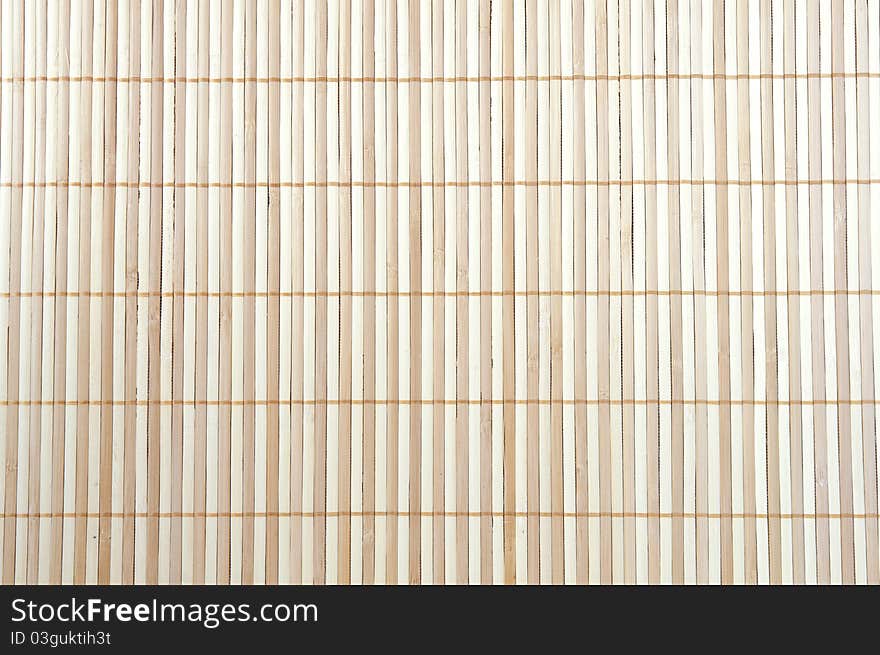 Beige striped background of a wooden mat