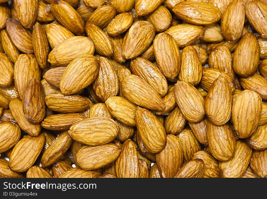 The almonds background. closeup macro almonds in honey