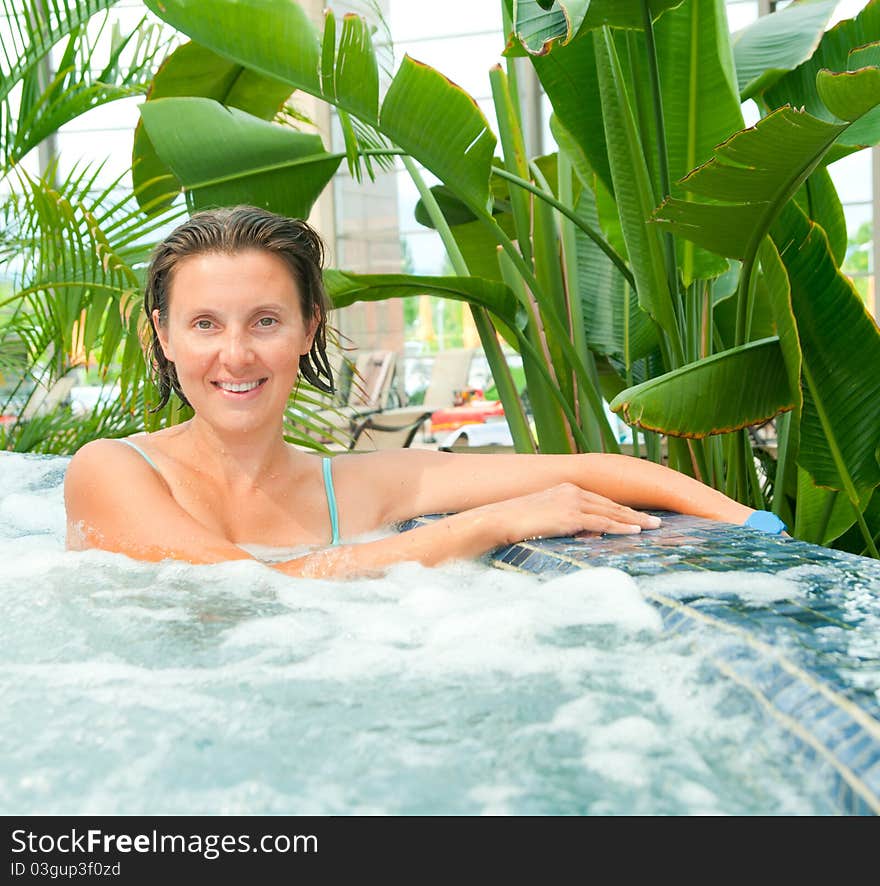 Attractive Young Woamn Relaxing In A Jacuzzi