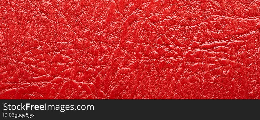 Closeup red leather texture to backround. Closeup red leather texture to backround