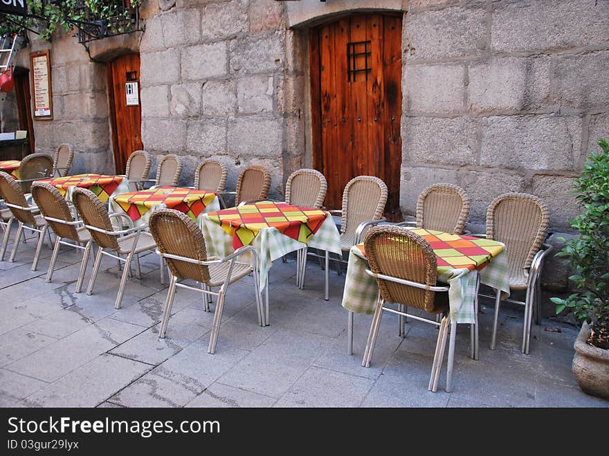 Outdoor set of dining tables in a rustic restaurant. Outdoor set of dining tables in a rustic restaurant