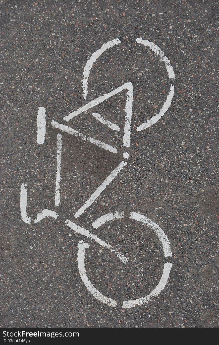 White bicycle on asphalt