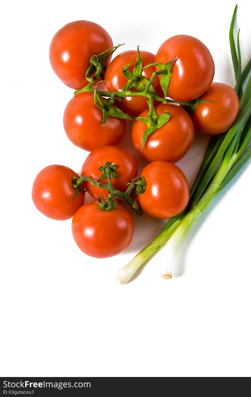 Wet whole tomatos arranged at the market isolated on a white background