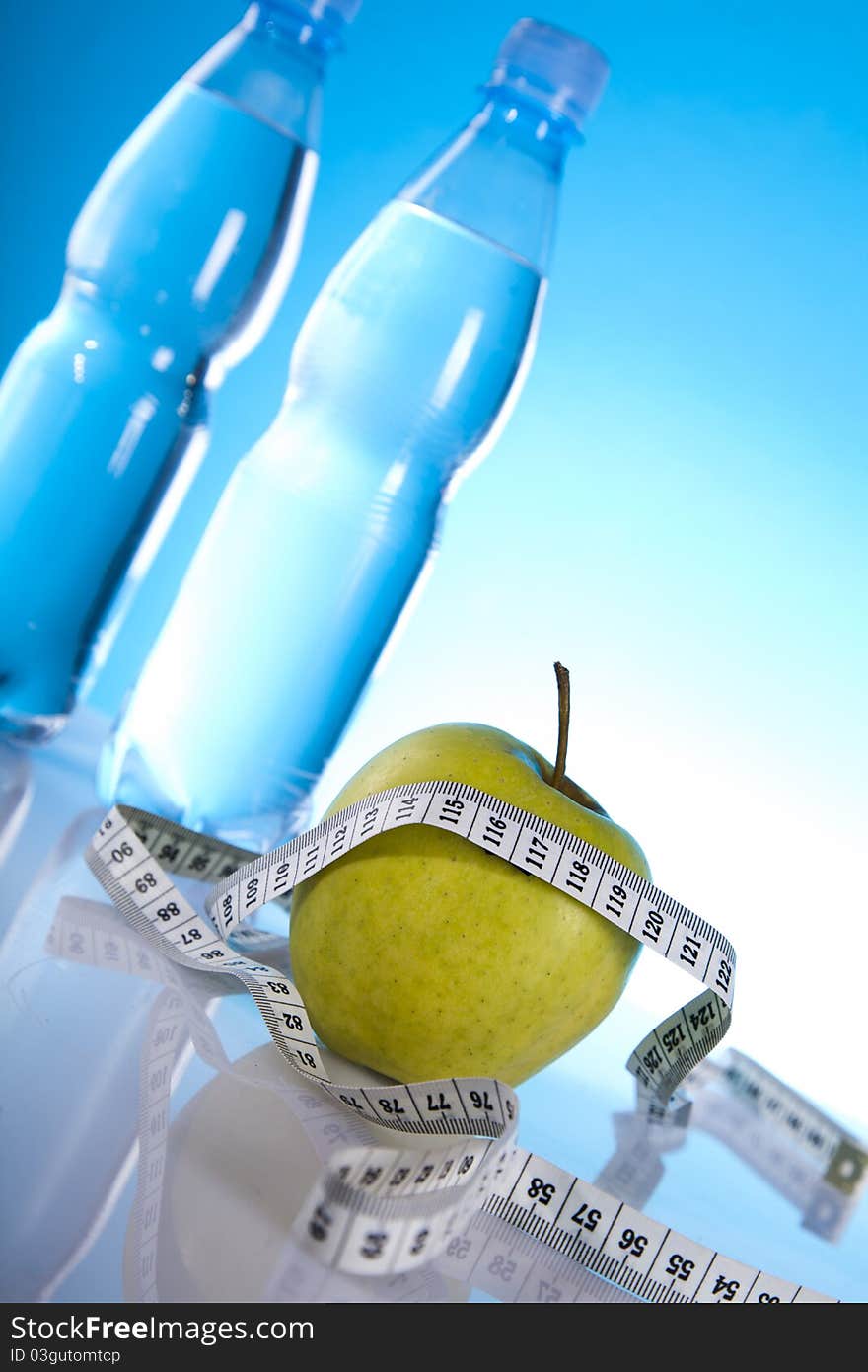 Mineral water with fruits and measuring tape. Mineral water with fruits and measuring tape