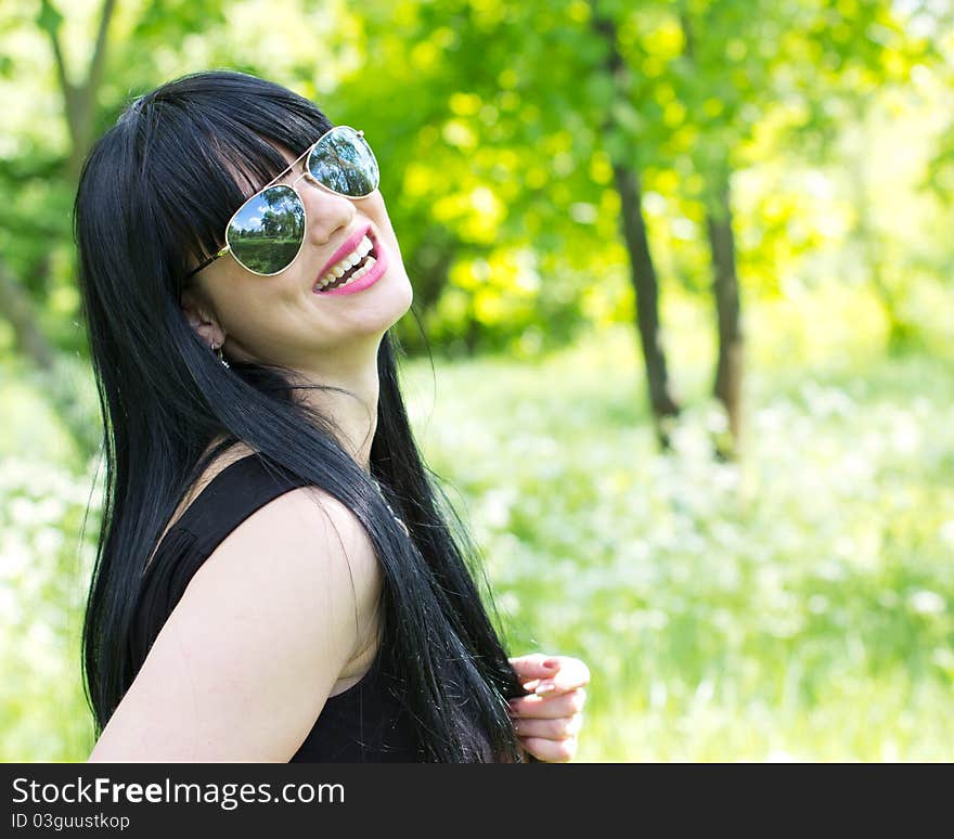 Beautiful young woman wearing sunglasses