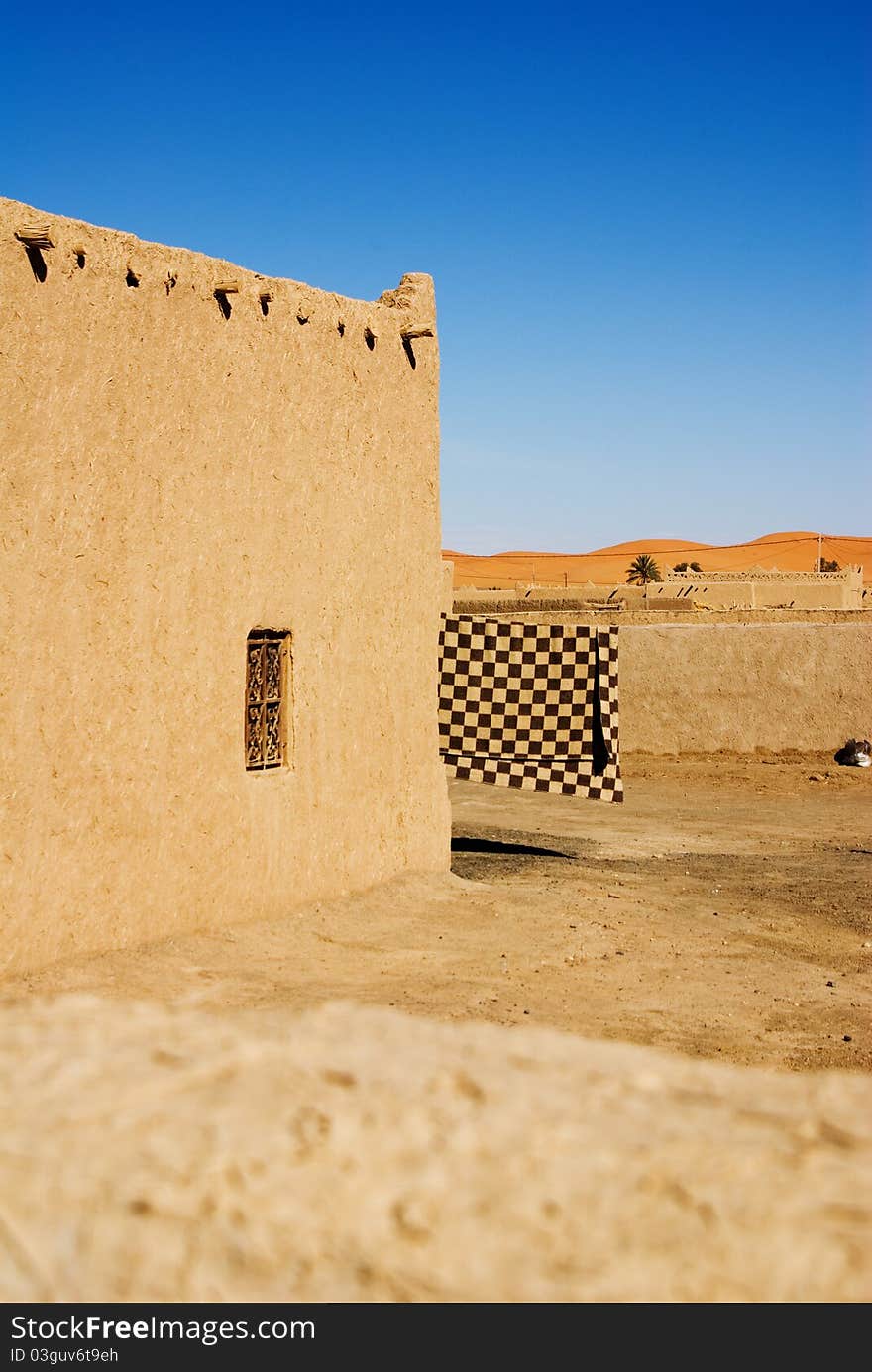 Houses of barber village close to the desert