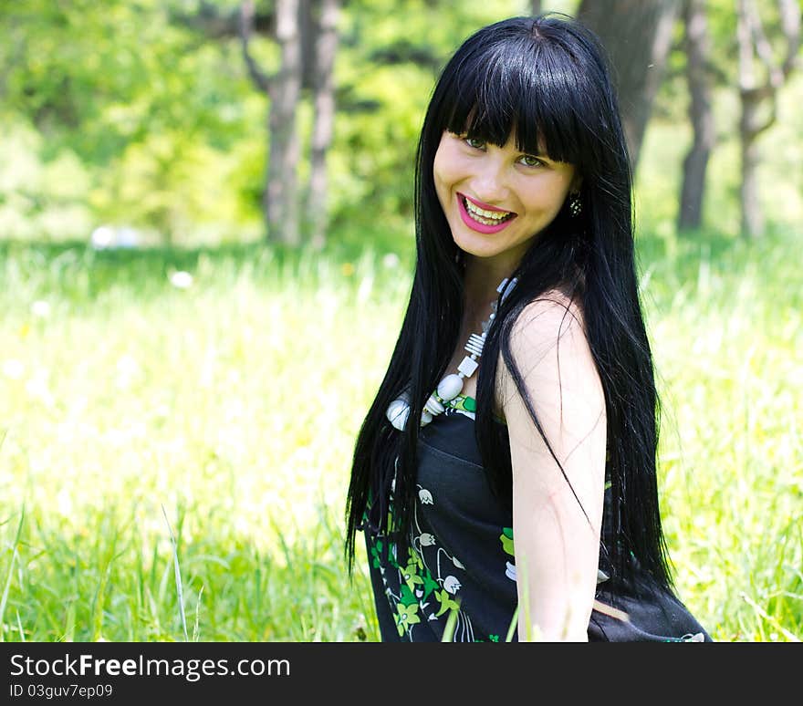 Single beautiful woman relaxing at the park. Single beautiful woman relaxing at the park