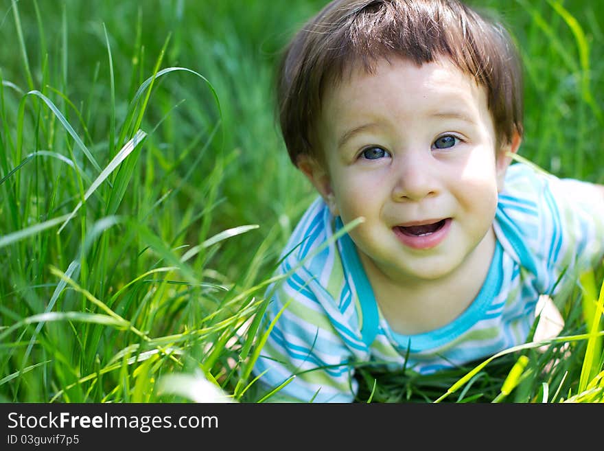 Little boy on the green grass. Little boy on the green grass