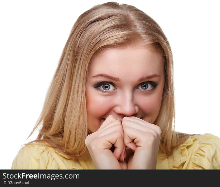 Portrait shot of a beautiful caucasian woman. Holding her face in astonishment.