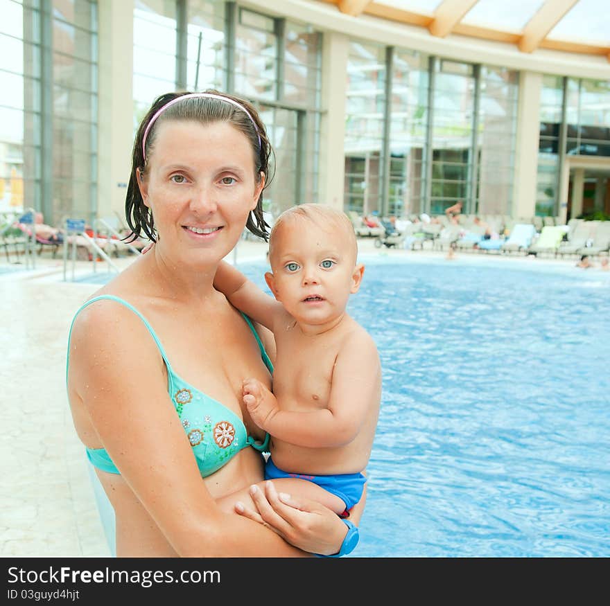 The mother and the baby boy in aquapark. The mother and the baby boy in aquapark