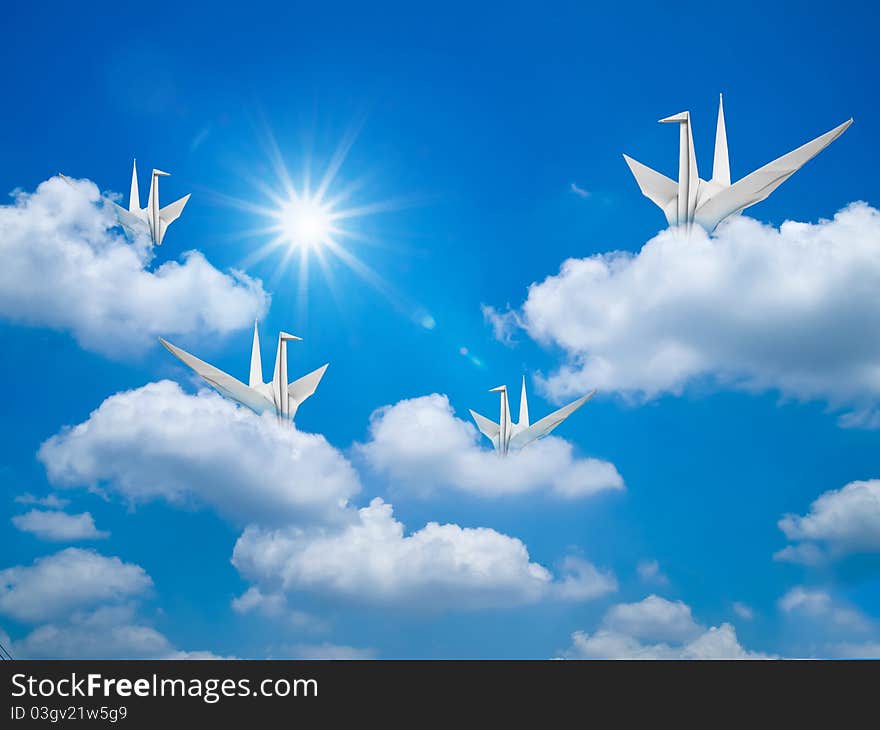 Paper bird in Bright blue sky