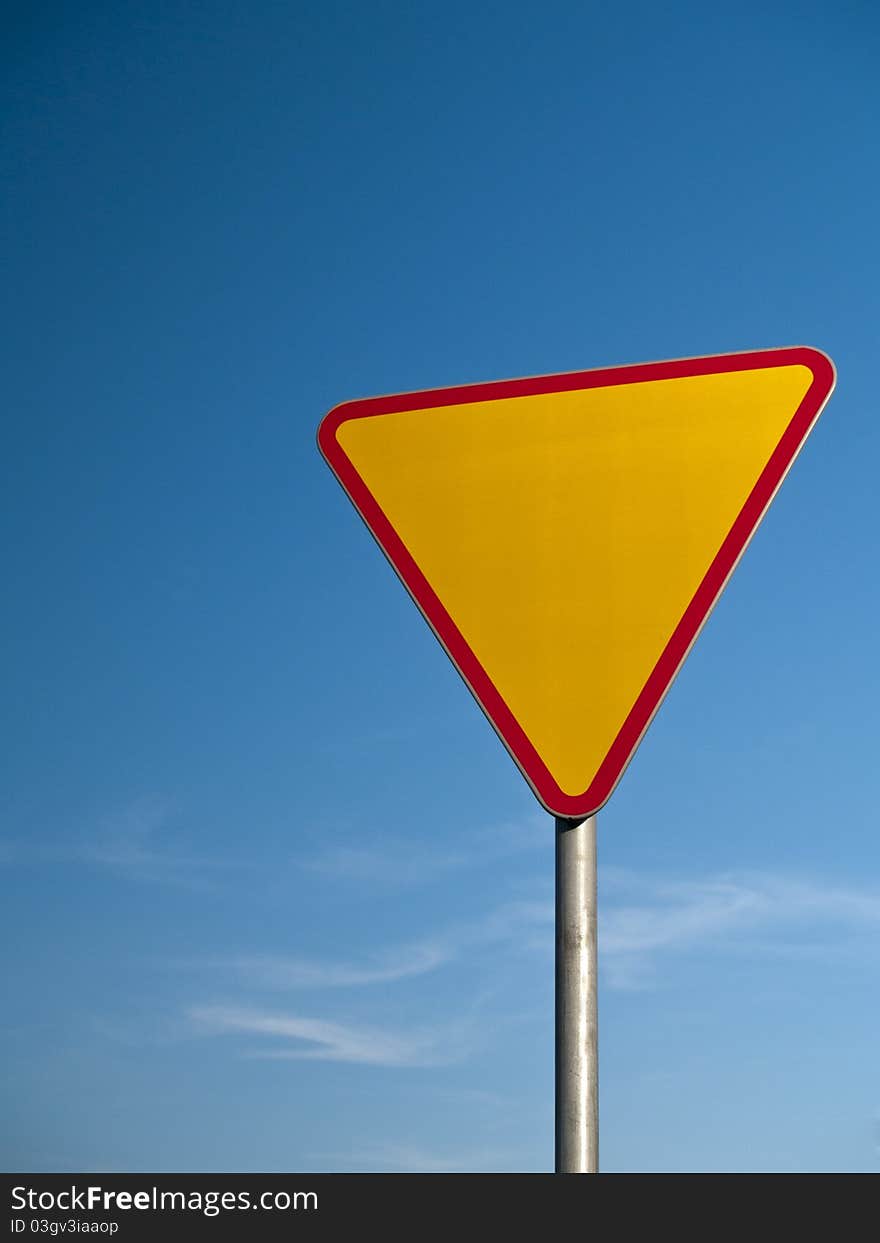 Photo of a road sign - give way to the right of way. Photo of a road sign - give way to the right of way