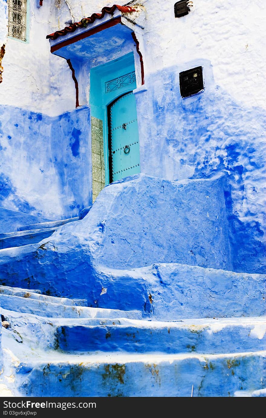 Blue house and house wall