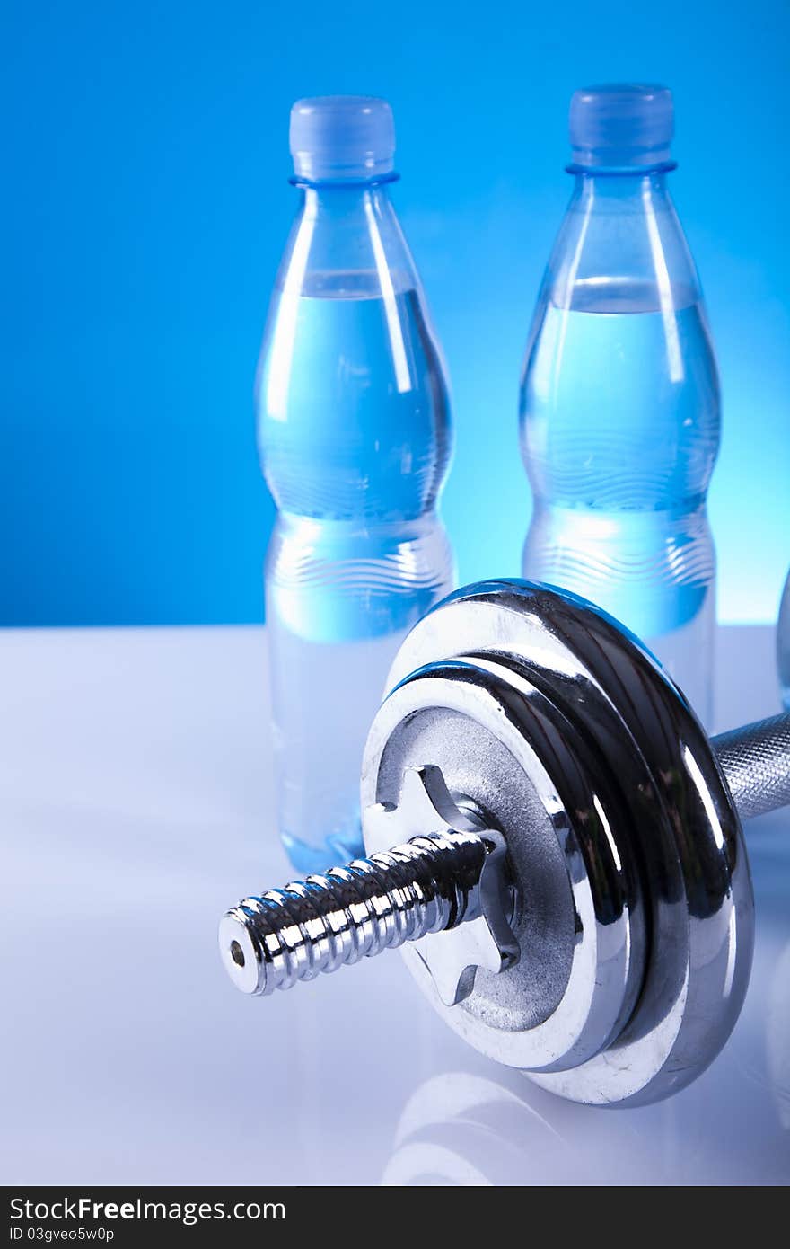 Dumbells and bottles of mineral water