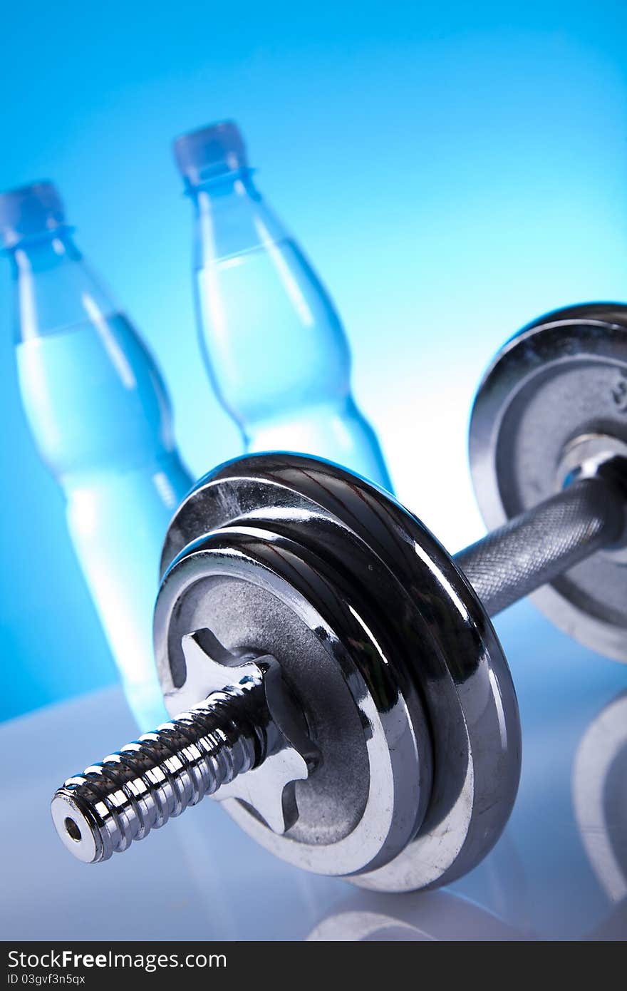 Dumbells and bottles of mineral water