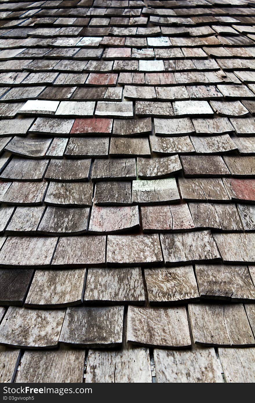 Old worn shingle roof pattern in thailand