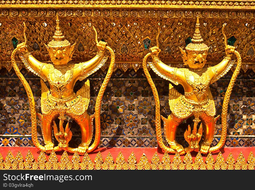 Garuda gold color in the Temple Emerald Church Bangkok Thailand