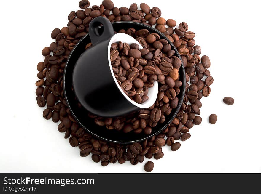 Coffee mug with coffee beans