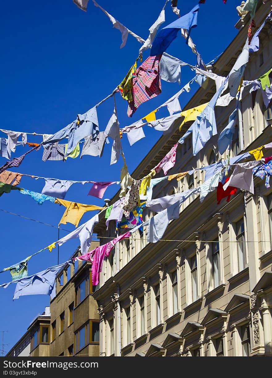 Colored Shirts On A Clothesline With Building