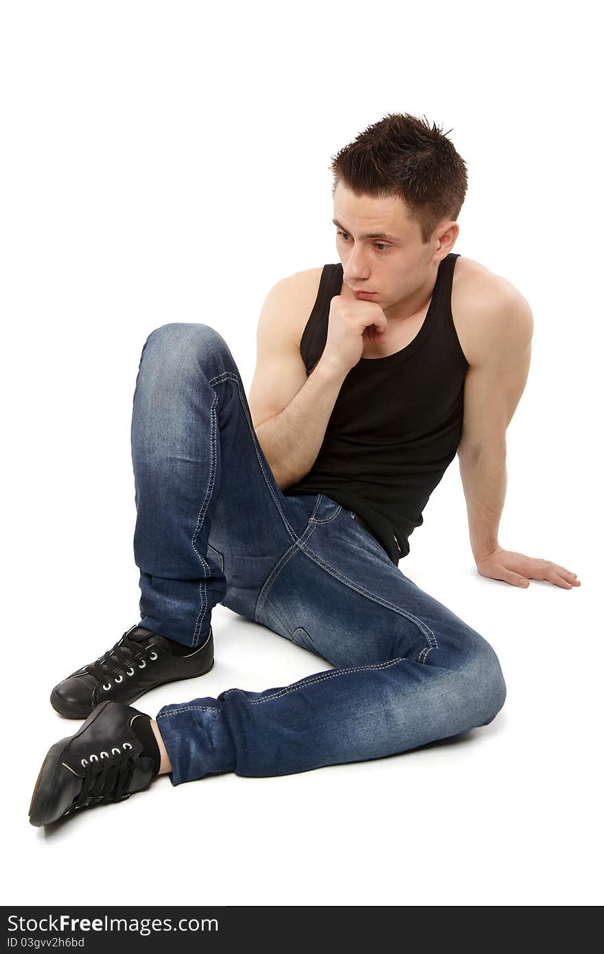 Young man thinking and hand resting on. Young man thinking and hand resting on