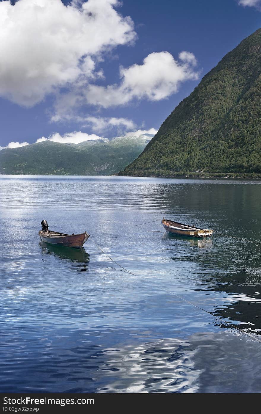 Norwegian boats in fiord under the sunshine