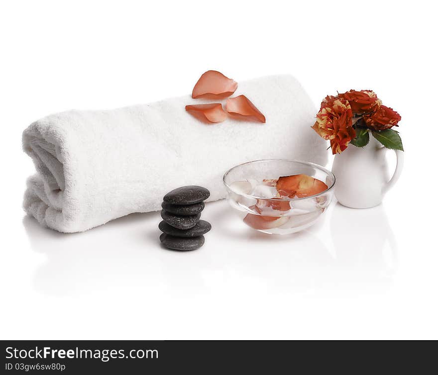 Spa with rose petals on white background