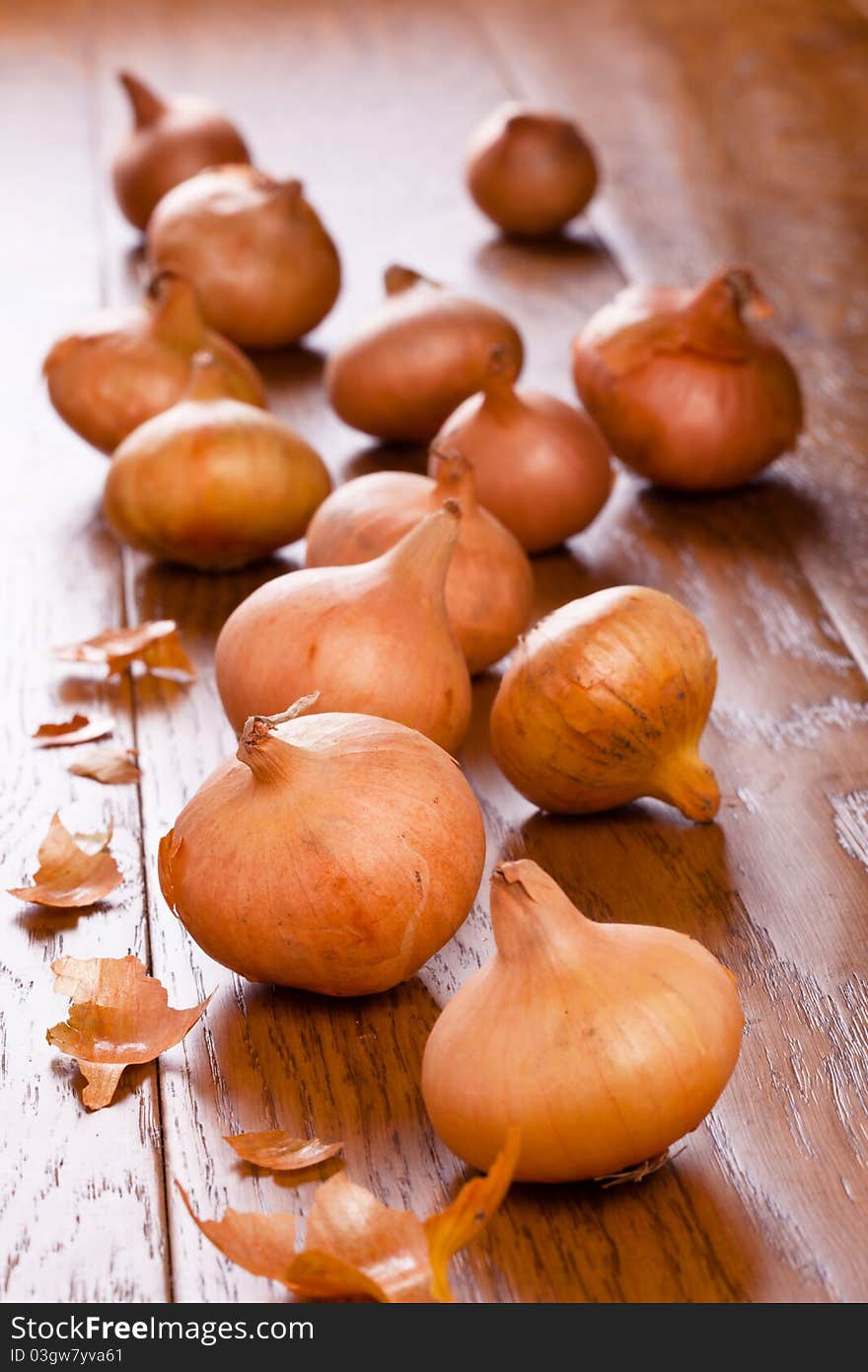 Small onions on a wooden table