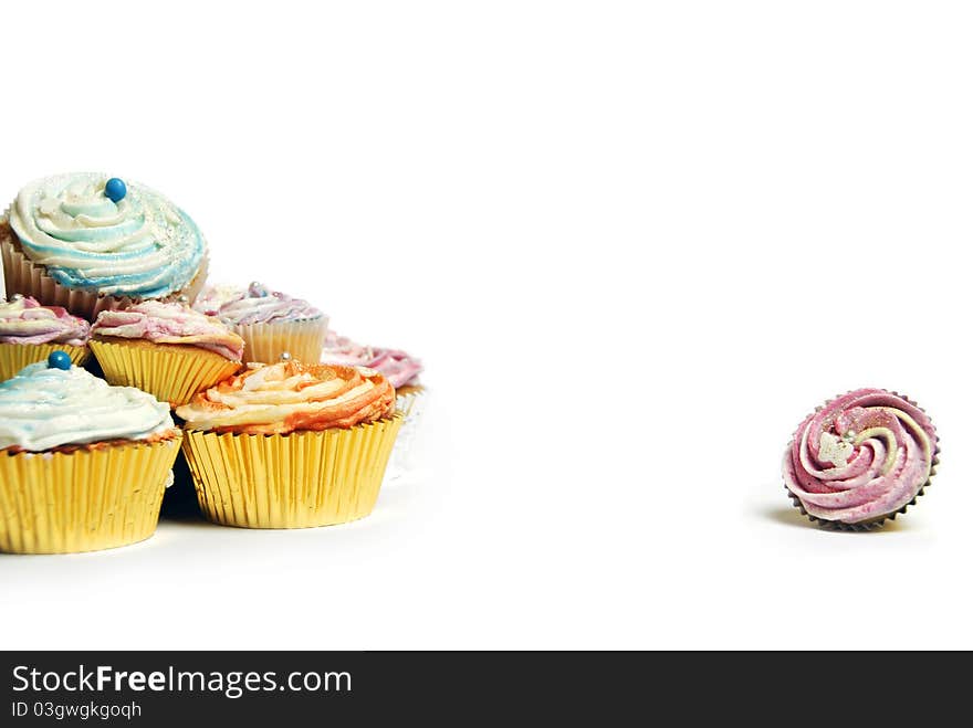 One small cupcake isolated from the rest. One small cupcake isolated from the rest