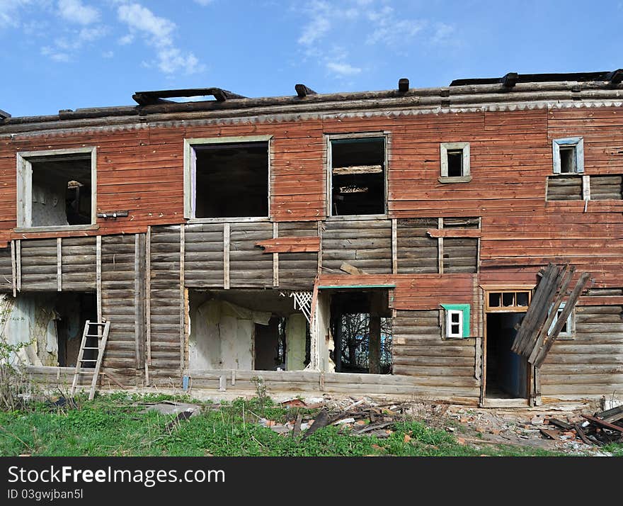 Facade of old abandoned destroyed wooden house. Facade of old abandoned destroyed wooden house