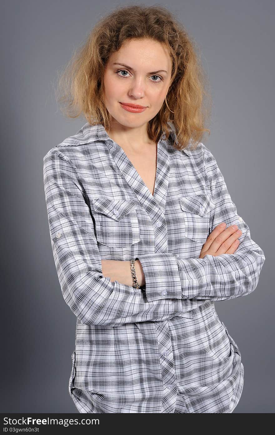 Portrait of the active woman, on a grey background