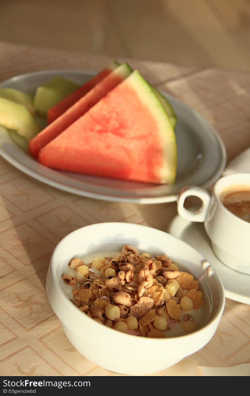 Image of a breakfast table with sliced watermelon. Image of a breakfast table with sliced watermelon