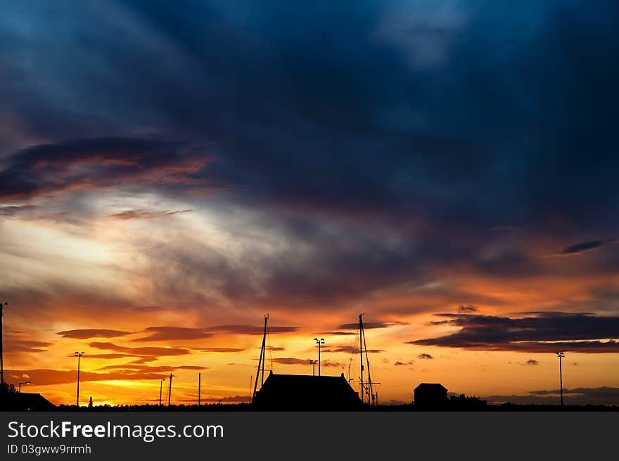 Vibrant sunset with buildings in the foreground