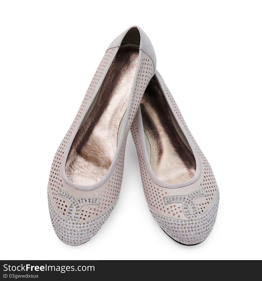 Female shoes with crystals are isolated on the white. Female shoes with crystals are isolated on the white