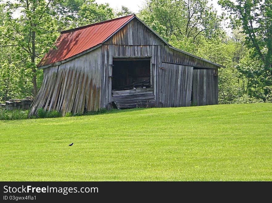 A small barn in Ohio leaning perilously. A small barn in Ohio leaning perilously