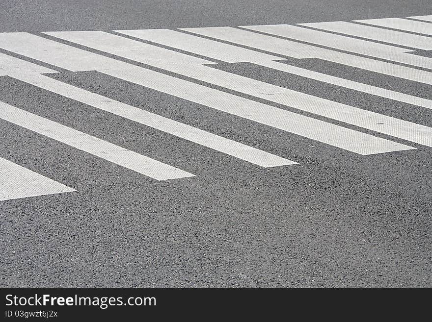 White piano painted pedestrian crossing on the road in Warsaw, Poland. Abstract musical background.