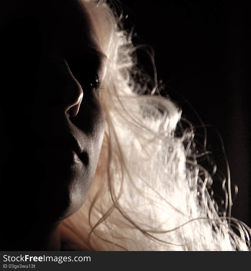 Light playing with womans hair. Light playing with womans hair